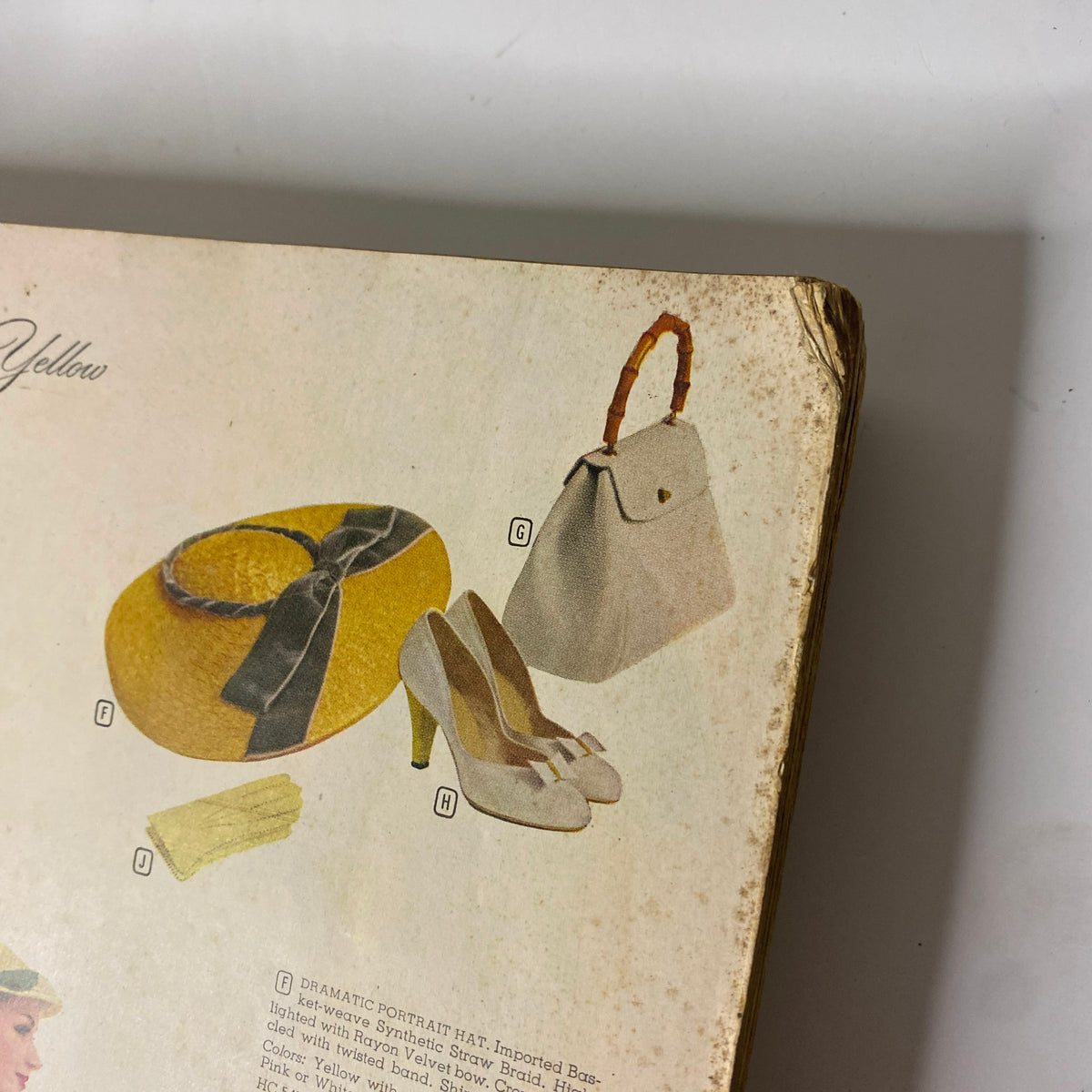 Close-up view of accessories featured in the 1956 Montgomery Ward Spring and Summer Catalog, including a yellow hat, shoes, and handbag.