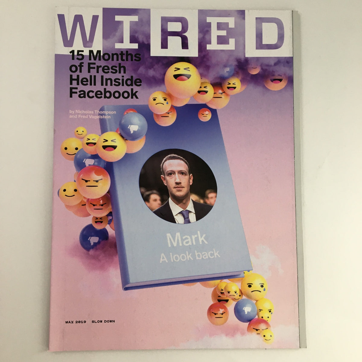 Wired Magazine May 2019 cover featuring an article titled '15 Months of Fresh Hell Inside Facebook' by Nicholas Thompson and Fred Vogelstein, showcasing a portrait of Mark Zuckerberg with emoticons in the background, representing social media themes.
