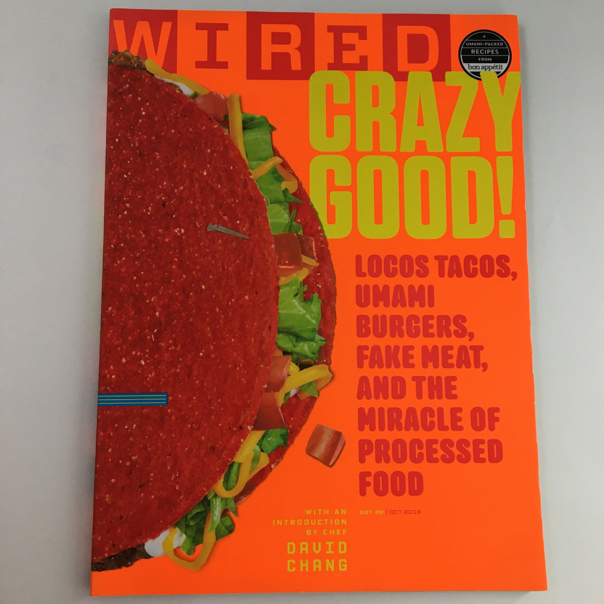 Wired Magazine October 2013 cover featuring the title 'Crazy Good!' with a vibrant design showcasing vibrant tacos, burgers, and processed food, introduced by Chef David Chang. This issue explores innovative food concepts.