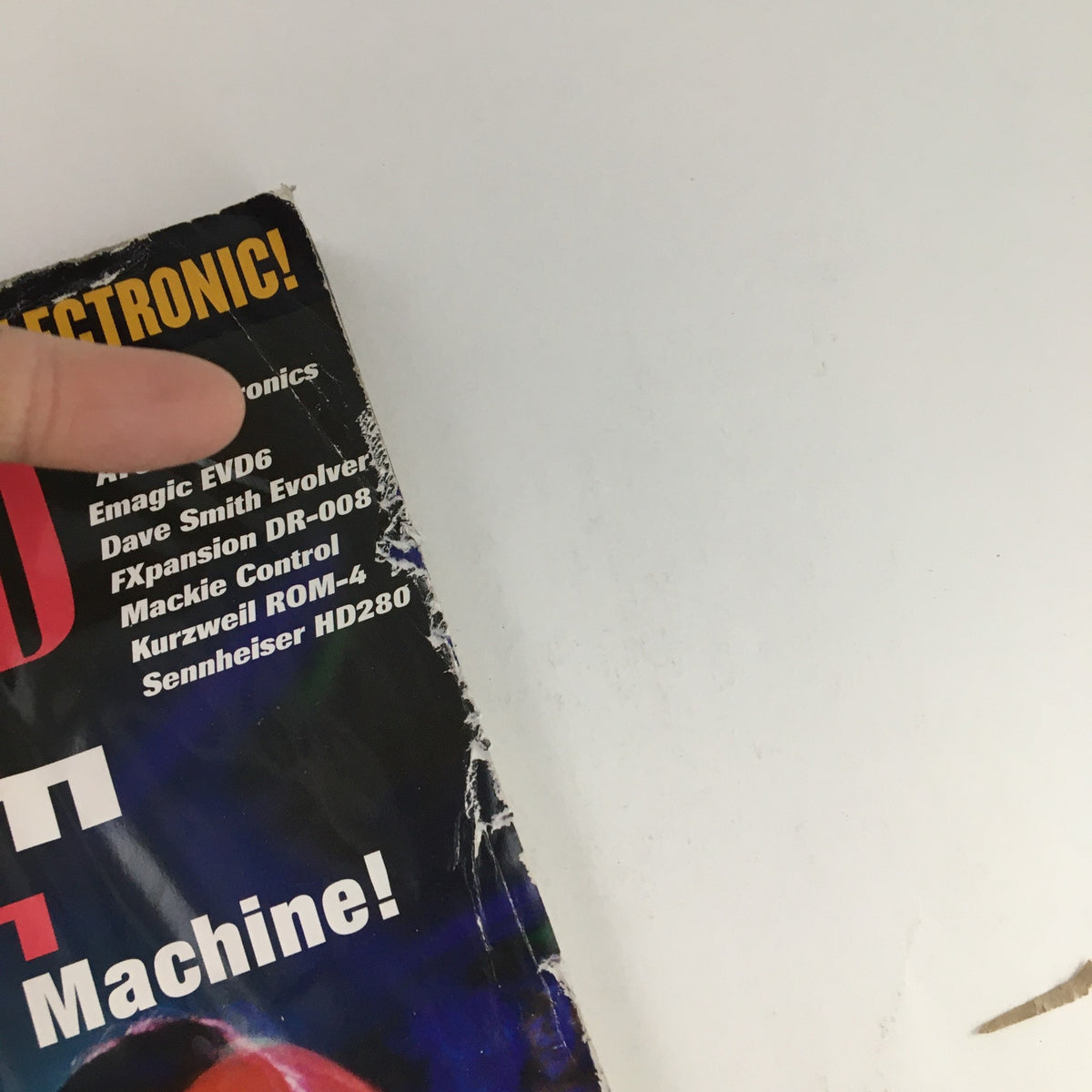 Close-up of the torn edge of Keyboard Magazine March 2003, featuring the Emagic EVD6 and various electronic music products.