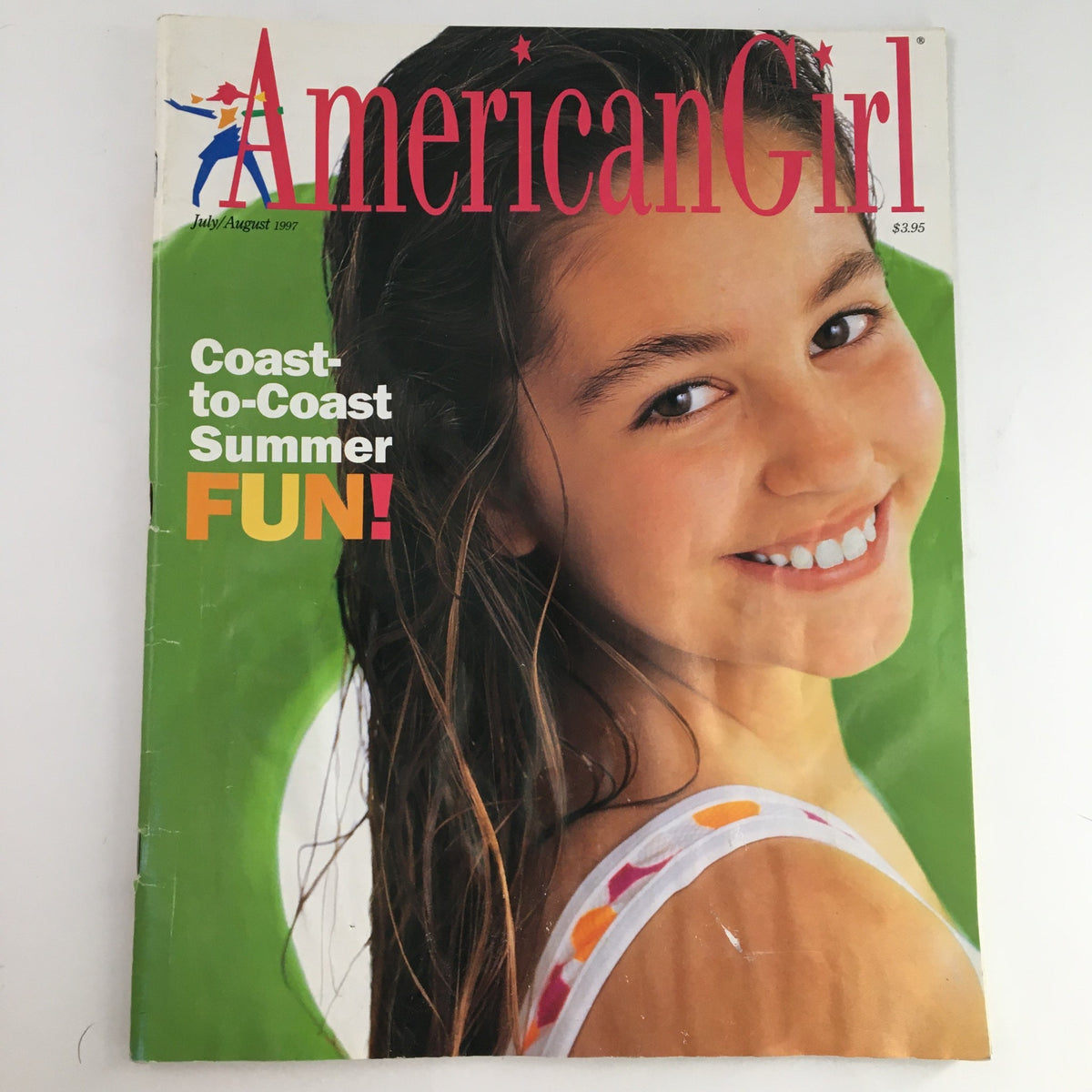 Cover of American Girl Magazine July August 1997 featuring the Coast-to-Coast Summer Fun theme with a smiling girl and vibrant colors.