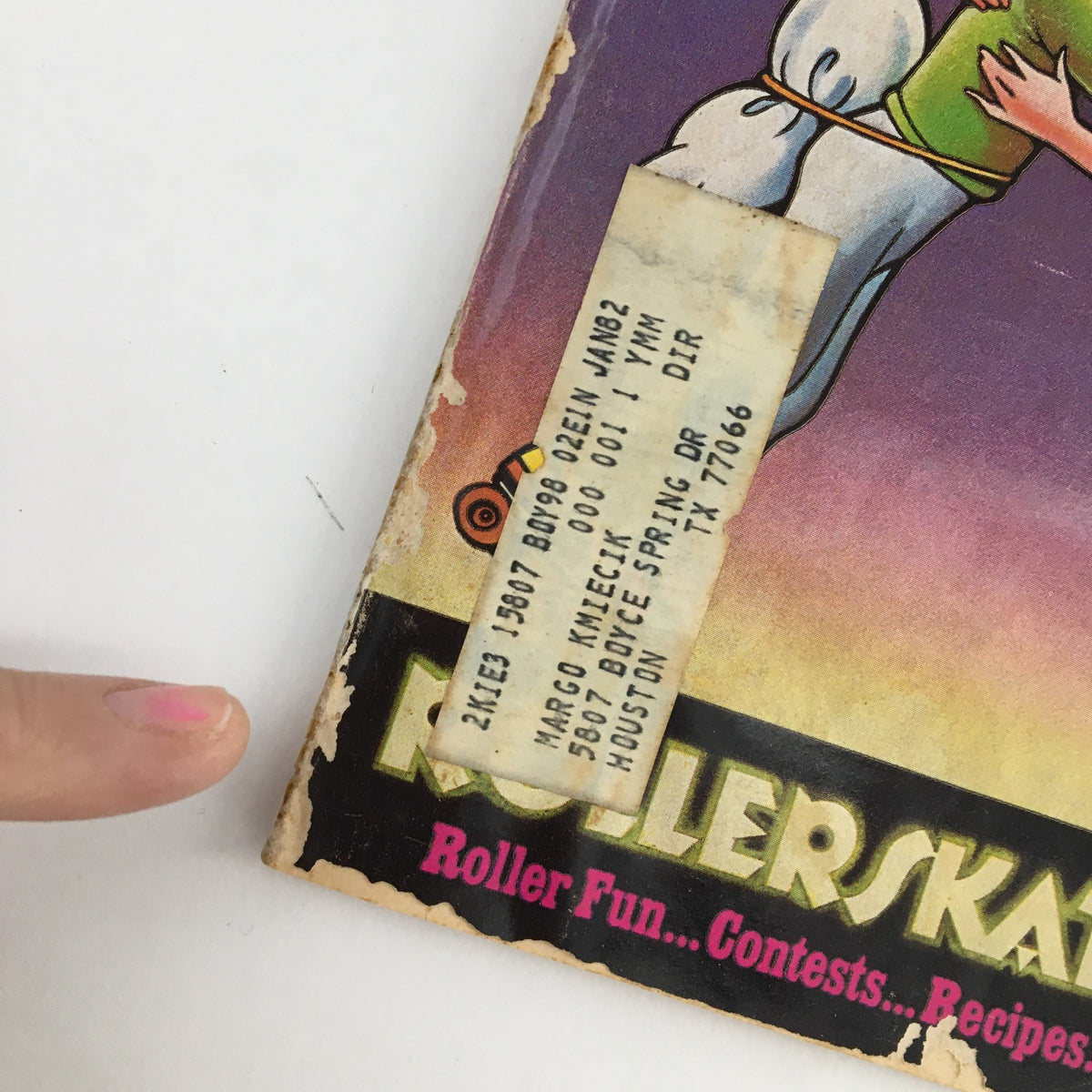 Close-up of the cover of Young Miss Magazine November 1979 featuring vibrant roller-skating graphics, showcasing the magazine's theme of 'Roller Fun... Contests... Recipes' with visible wear that reflects its vintage status.