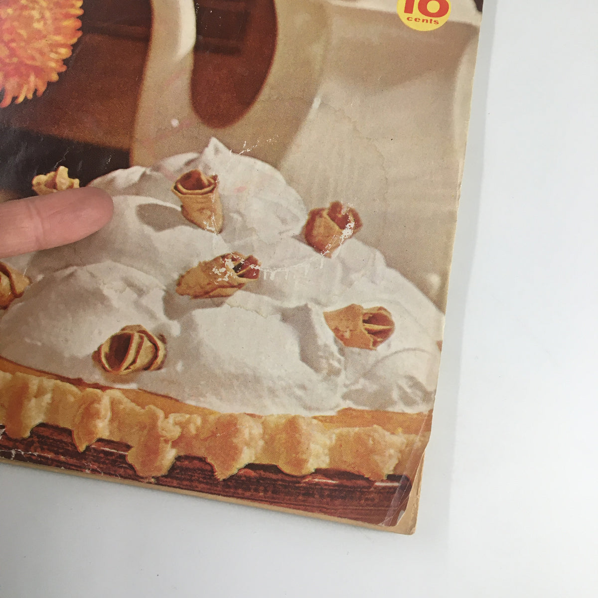 Close-up of the dessert from the cover of the VTG Family Circle Magazine November 1961, highlighting the whipped cream and pastry details.