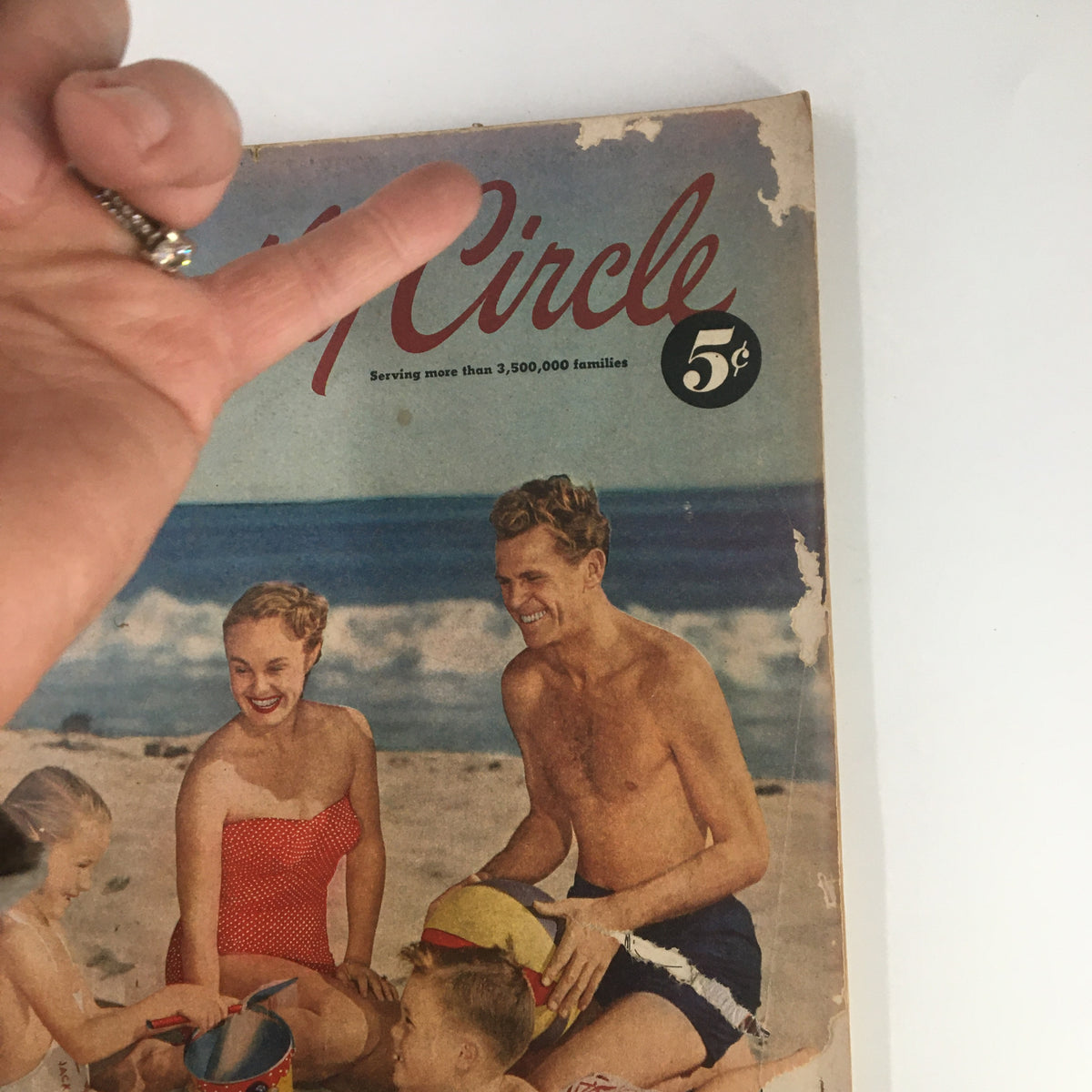 Close-up of the Vintage Family Circle Magazine August 1952 cover with a family at the beach, emphasizing the nostalgic summer fun and vibrant colors.
