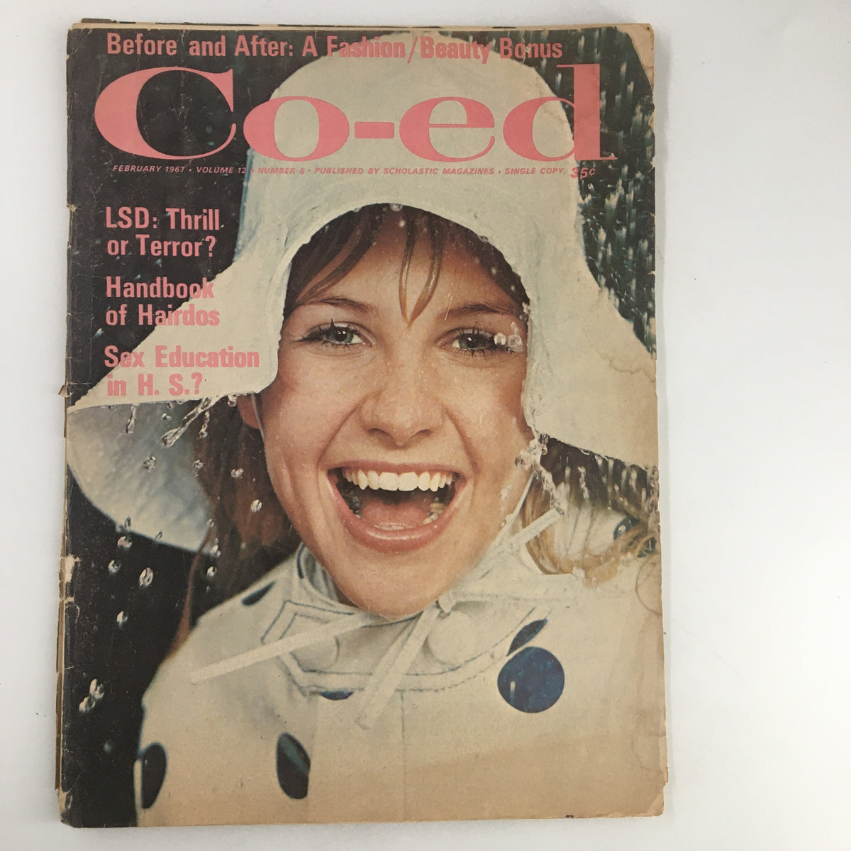 Cover of VTG Co-Ed Magazine February 1967 titled 'I Loved Paris Every Moment' featuring a smiling woman in a raincoat, showcasing vintage fashion and cultural themes of the 1960s.