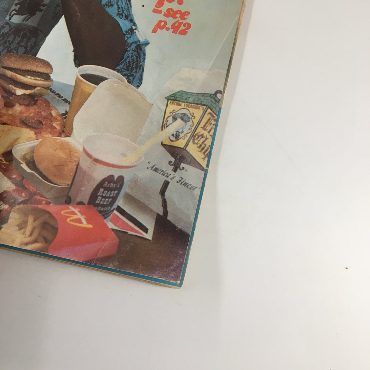 Inside page of VTG Campus Life Magazine August 1976 displaying food items including burgers and soda, highlighting the 'Junk Foods Stack' theme.
