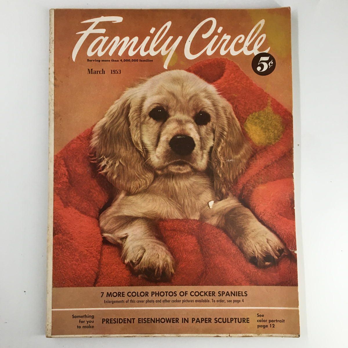 Cover of VTG Family Circle Magazine March 1953 featuring a paper sculpture of President Eisenhower and a cocker spaniel dog. This nostalgic piece of Americana is a collectible from the early 1950s.