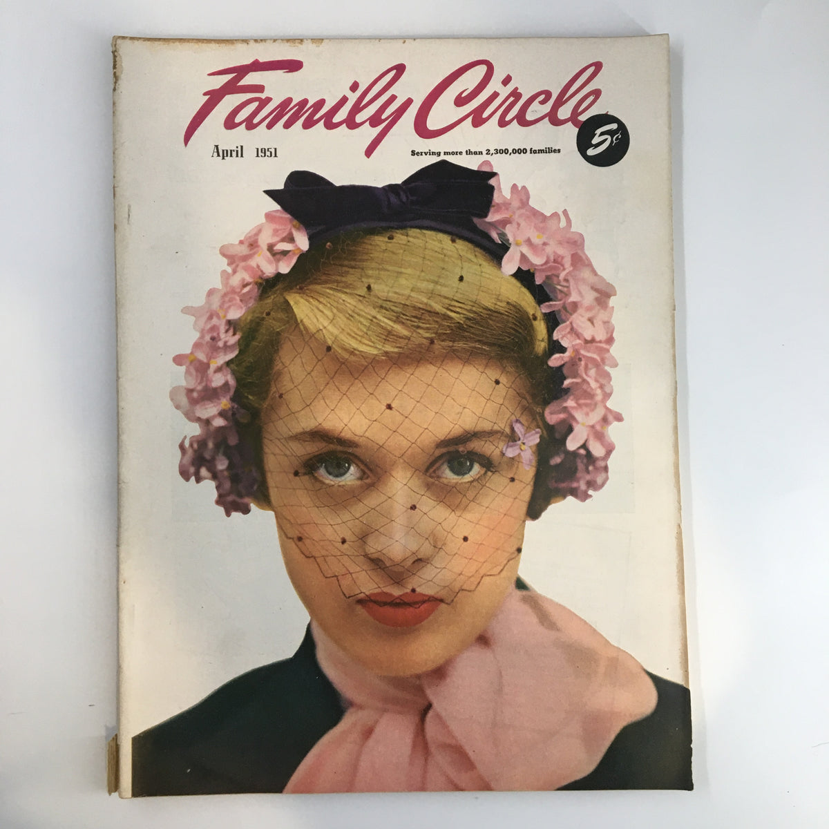 Vintage Family Circle Magazine cover from April 1951 featuring a woman adorned with flowers and a veil. This issue highlights Libby's Fruit-Freeze Cake Recipe, making it a collectible for culinary enthusiasts.
