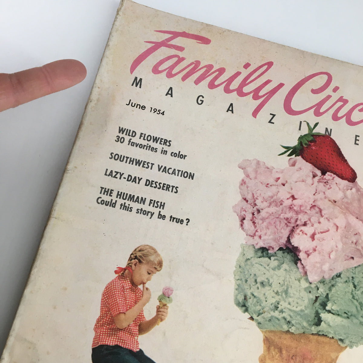 Cover of VTG Family Circle Magazine June 1954 featuring Lazy-Day Desserts with a girl enjoying ice cream, showcasing vintage design and nostalgic appeal.