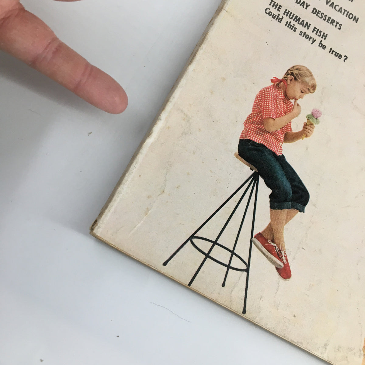 Side view of the VTG Family Circle Magazine June 1954 cover displaying Lazy-Day Desserts, featuring a girl in a red checkered shirt eating ice cream.