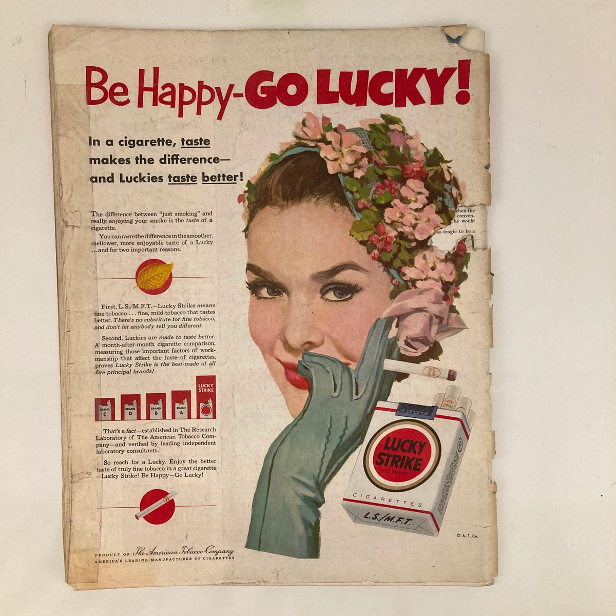 Vintage advertisement from the Saturday Evening Post Magazine April 5, 1952 featuring a glamorous woman promoting Lucky Strike cigarettes, with the slogan 'Be Happy - Go Lucky!' showcasing classic 1950s design elements and colors.