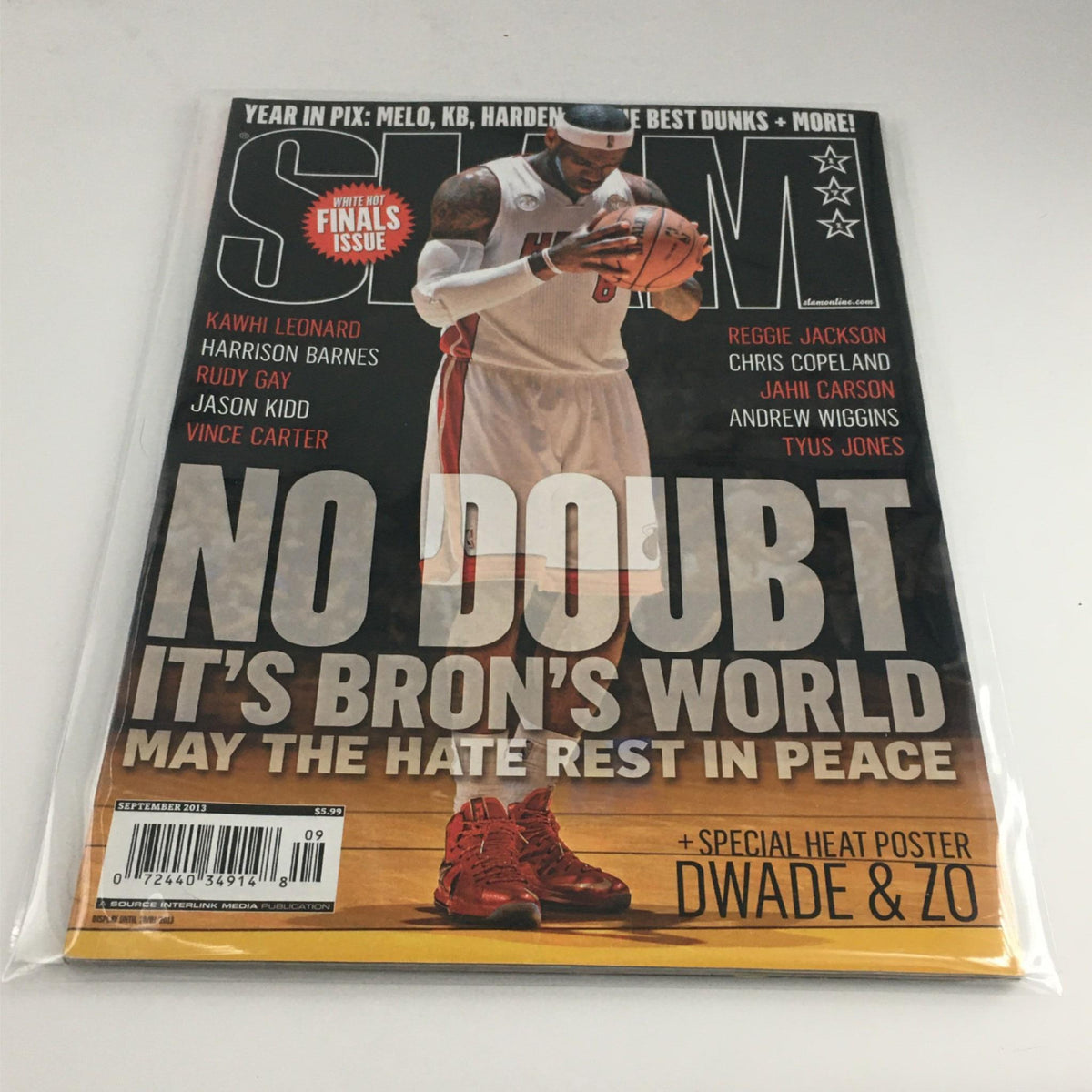 Slam Magazine September 2013 featuring LeBron James with the tagline 'No Doubt It's Bron's World', highlighting the Miami Heat star along with a special poster of Dwyane Wade and Chris Bosh.