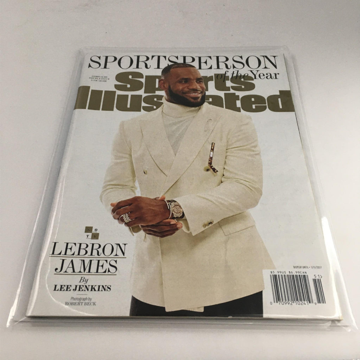 Sports Illustrated Magazine December 19, 2016 with LeBron James on the cover, displayed in protective plastic, highlighting its Near Mint Condition.