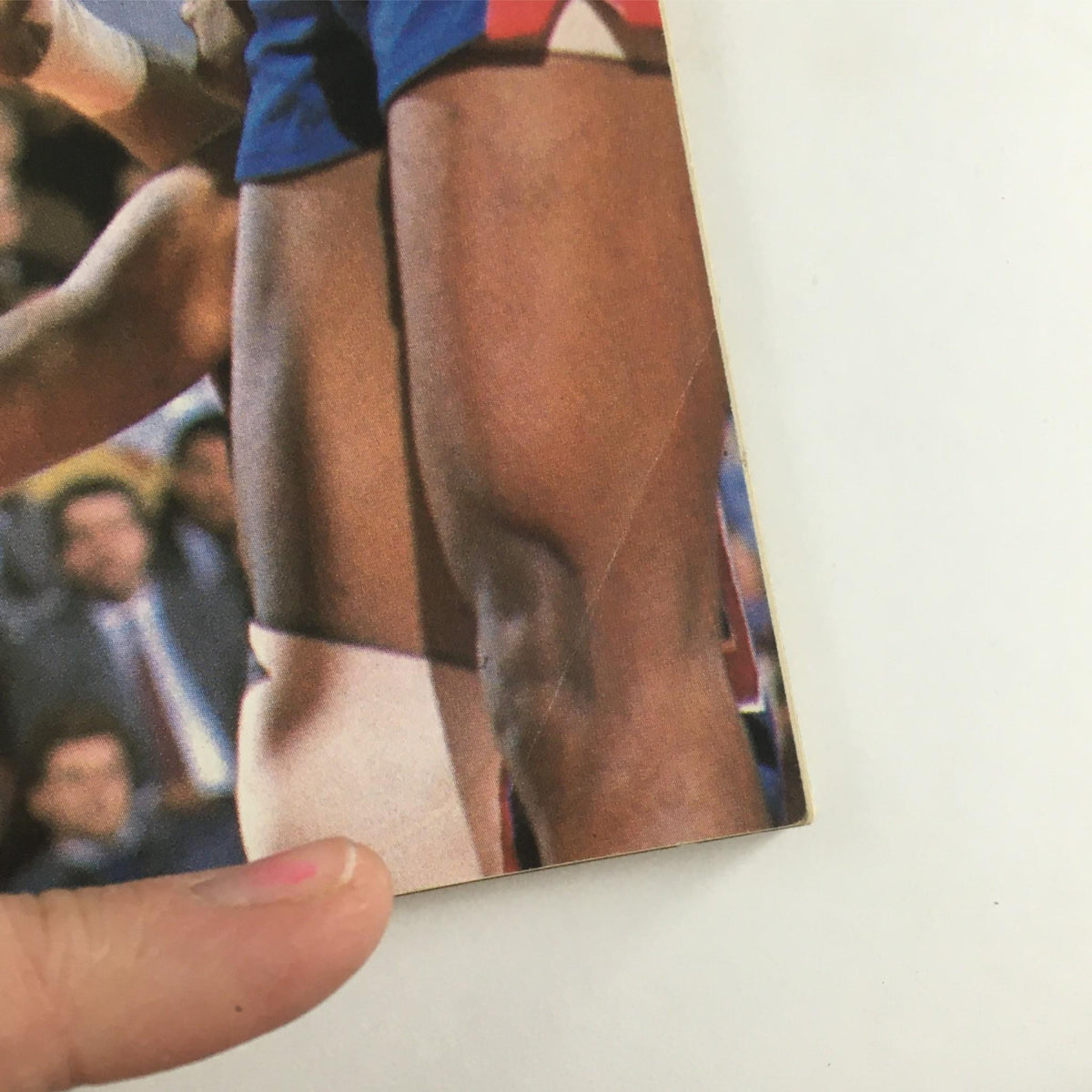Close-up of a basketball player’s leg during a game featured in the 1988 Hoop Magazine Michael Jordan, Houston Rockets Directory NBA. Rare collectible without a label.
