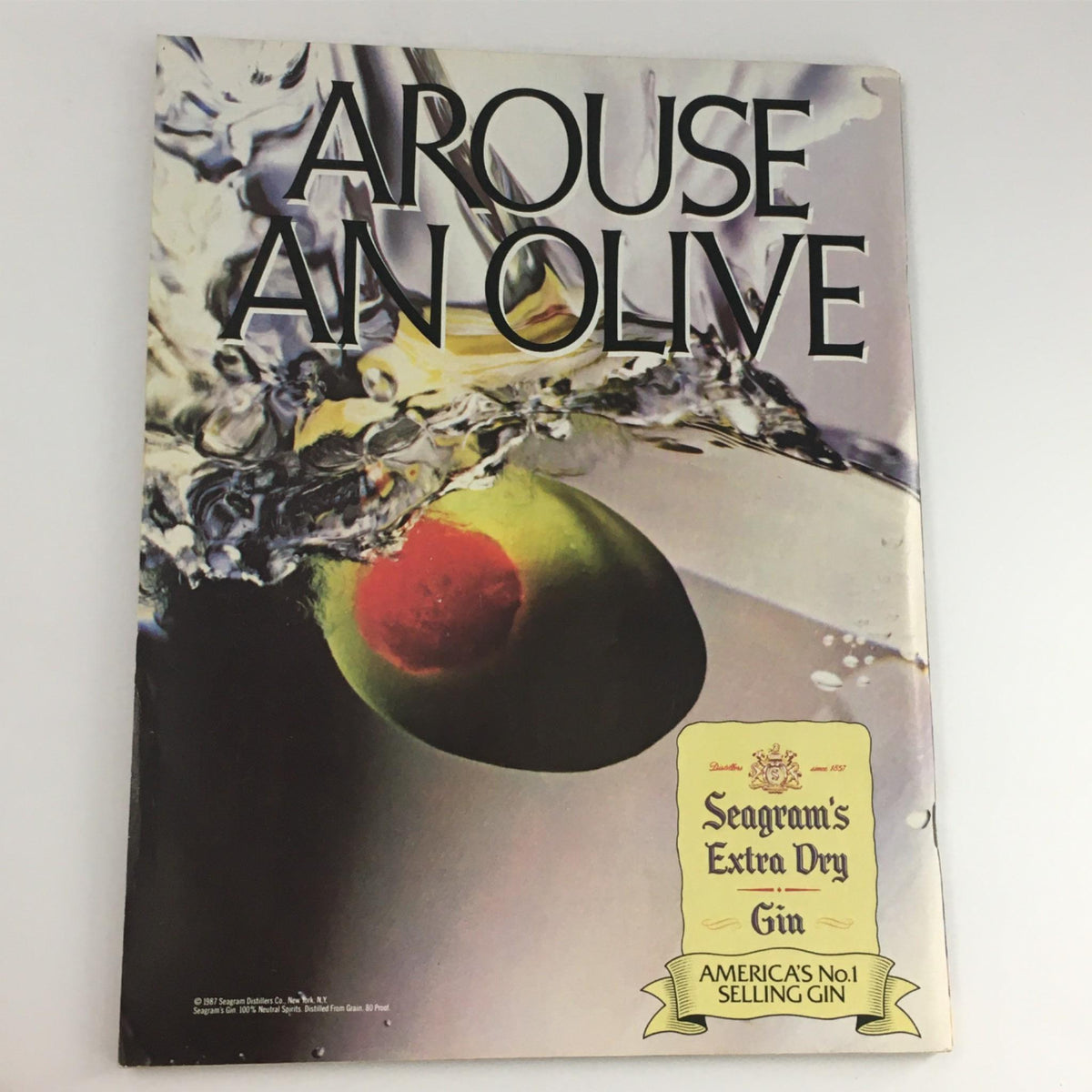 Advertisement page titled 'Arouse An Olive' from an 1988 magazine, featured in the 1988 Hoop Magazine Michael Jordan, Houston Rockets Directory NBA. Unique vintage content.