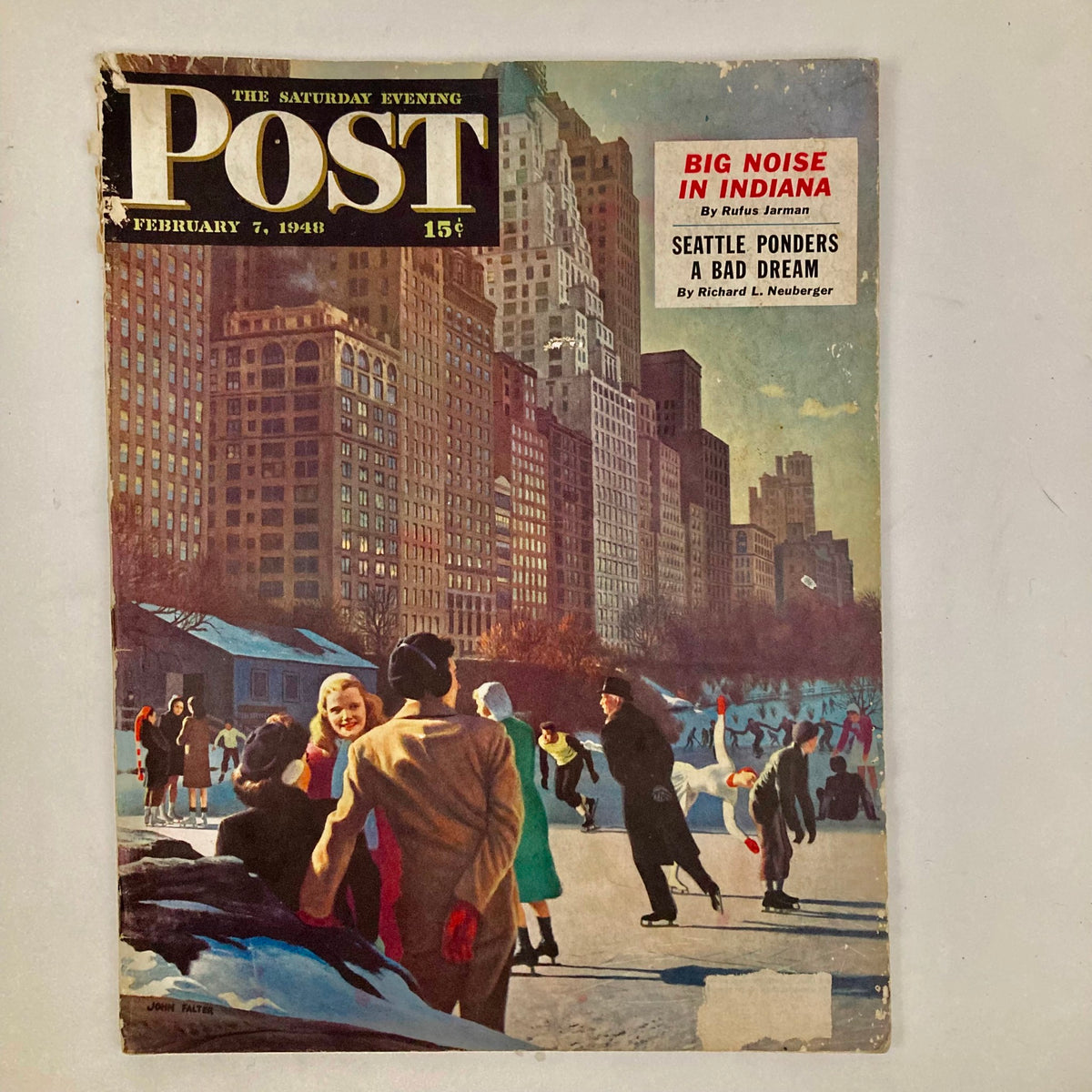 Cover of Saturday Evening Post Magazine February 7, 1948 featuring Central Park scene, showcasing people skating and enjoying winter activities in New York City. Artwork by John Falter.