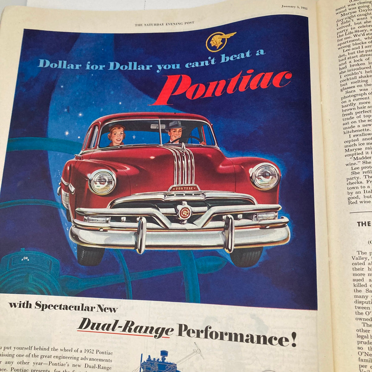 Cover of Saturday Evening Post Magazine January 5 1952 featuring a vintage ad for Pontiac with a red car, showcasing a couple enjoying a drive and highlighting the slogan 'Dollar for Dollar you can't beat a Pontiac'.