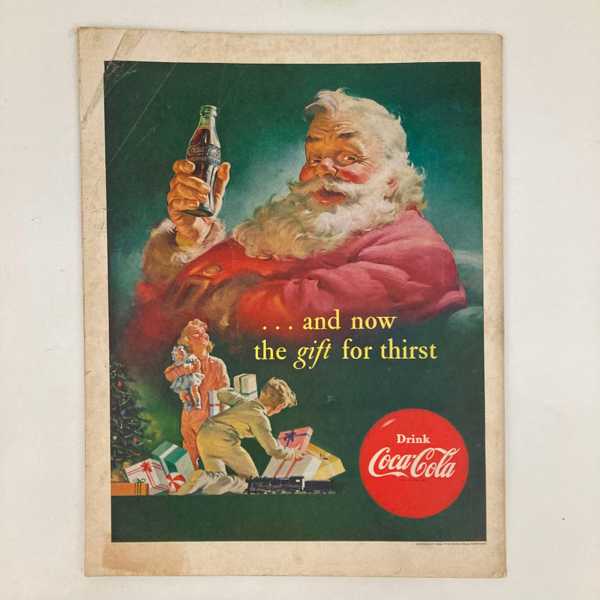 Cover page of the Saturday Evening Post Magazine from November 29, 1952 featuring Santa Claus with a Coca-Cola bottle, promoting holiday festivities with the slogan '...and now the gift for thirst.' This classic illustration represents 1950s Christmas advertising.