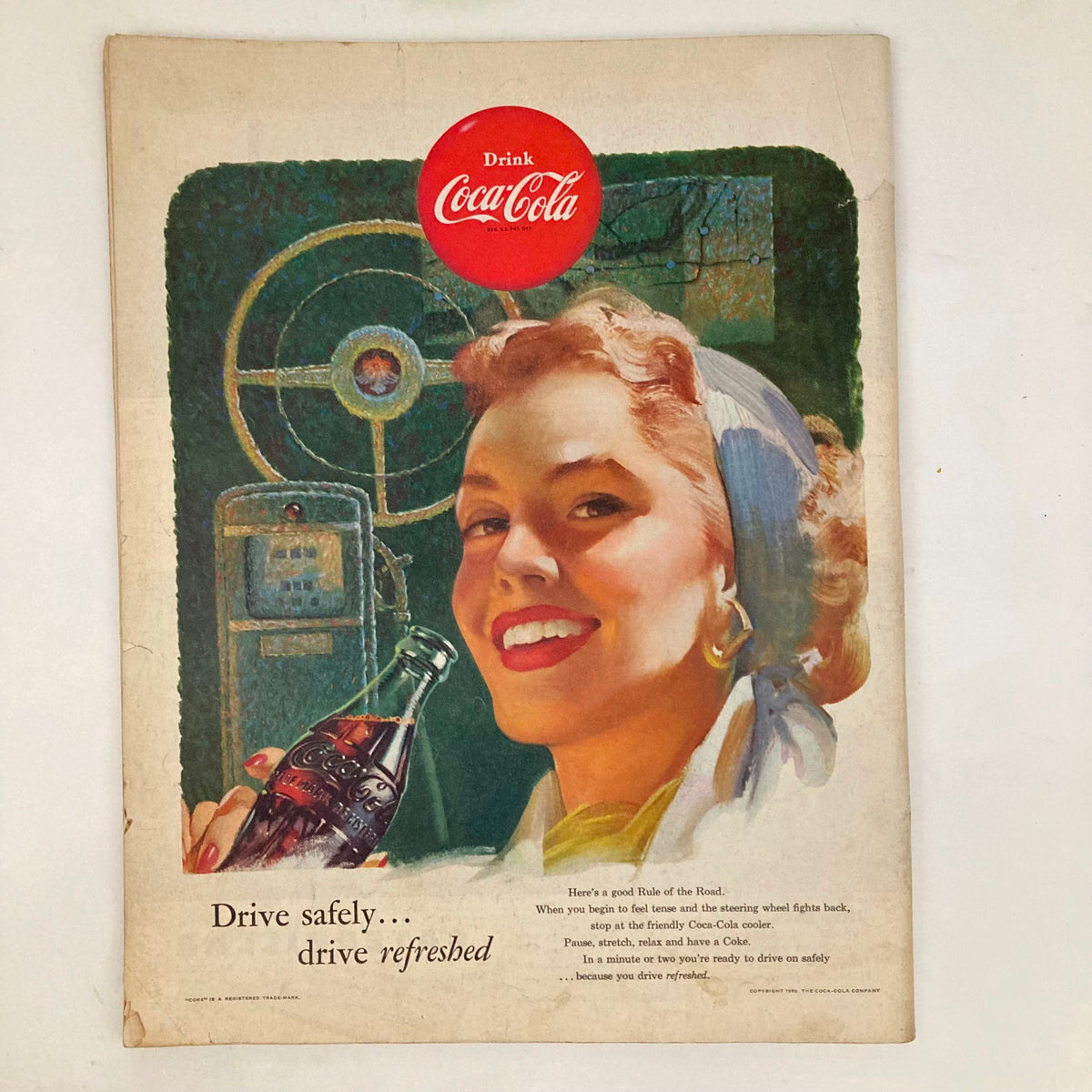 Vintage advertisement from Saturday Evening Post Magazine June 13 1953 depicting a cheerful woman enjoying a Coca-Cola, with the slogan 'Drive safely... drive refreshed,' embodying mid-20th century Americana.