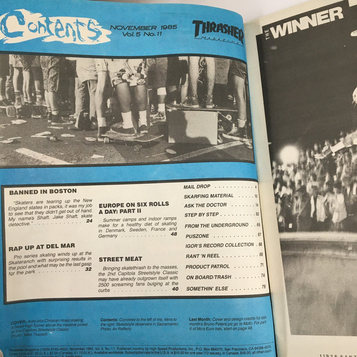 Contents page of VTG Thrasher Magazine November 1985 featuring articles like 'Banned in Boston' and 'Street Meat' along with a photo of skateboarders at an event, highlighting the vibrant skate culture of the 1980s.