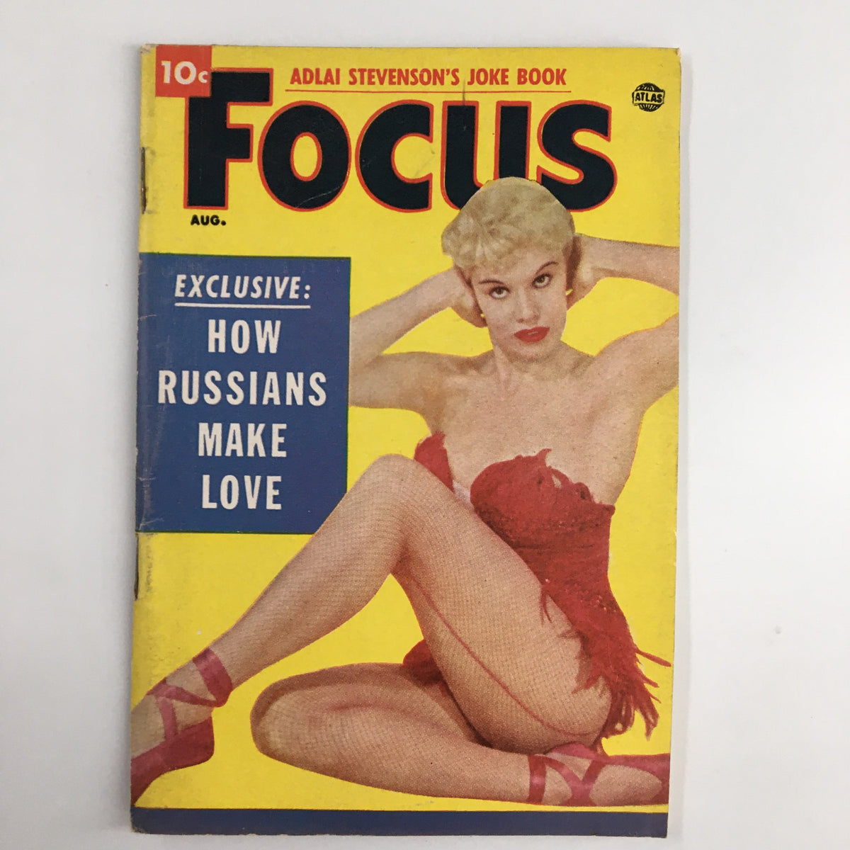 VTG Focus Magazine August 1954 cover featuring an article titled 'Exclusive: How Russians Make Love', showcasing a vintage image of a woman in a red outfit against a bright yellow background.