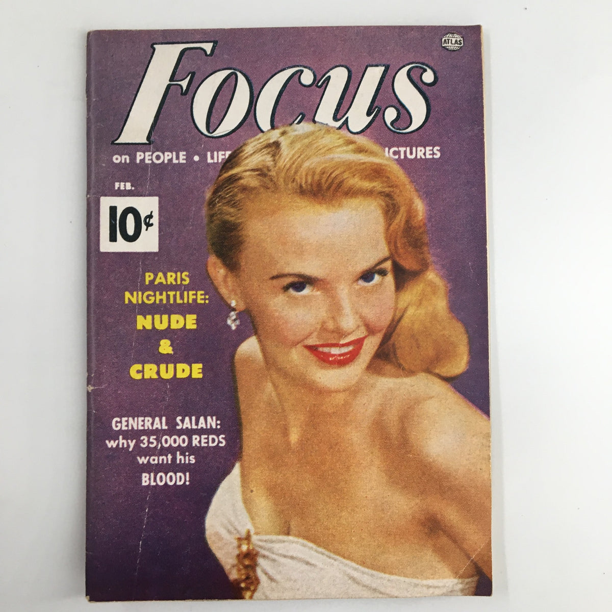 VTG Focus Magazine February 1953 cover featuring Paris nightlife, nude and crude theme, showcasing a blonde woman smiling on a purple background.