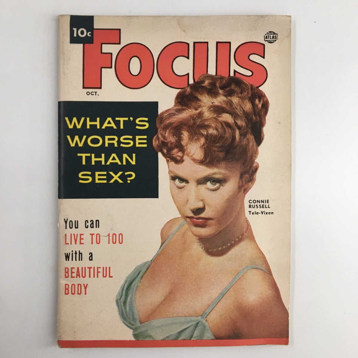 Vintage Focus Magazine, October 1954 issue featuring Connie Russell, known as 'The Tele-Vixen'. Cover displays the striking headline 'What's Worse Than Sex?' and a captivating image of Connie Russell, emphasizing mid-20th century glamour.