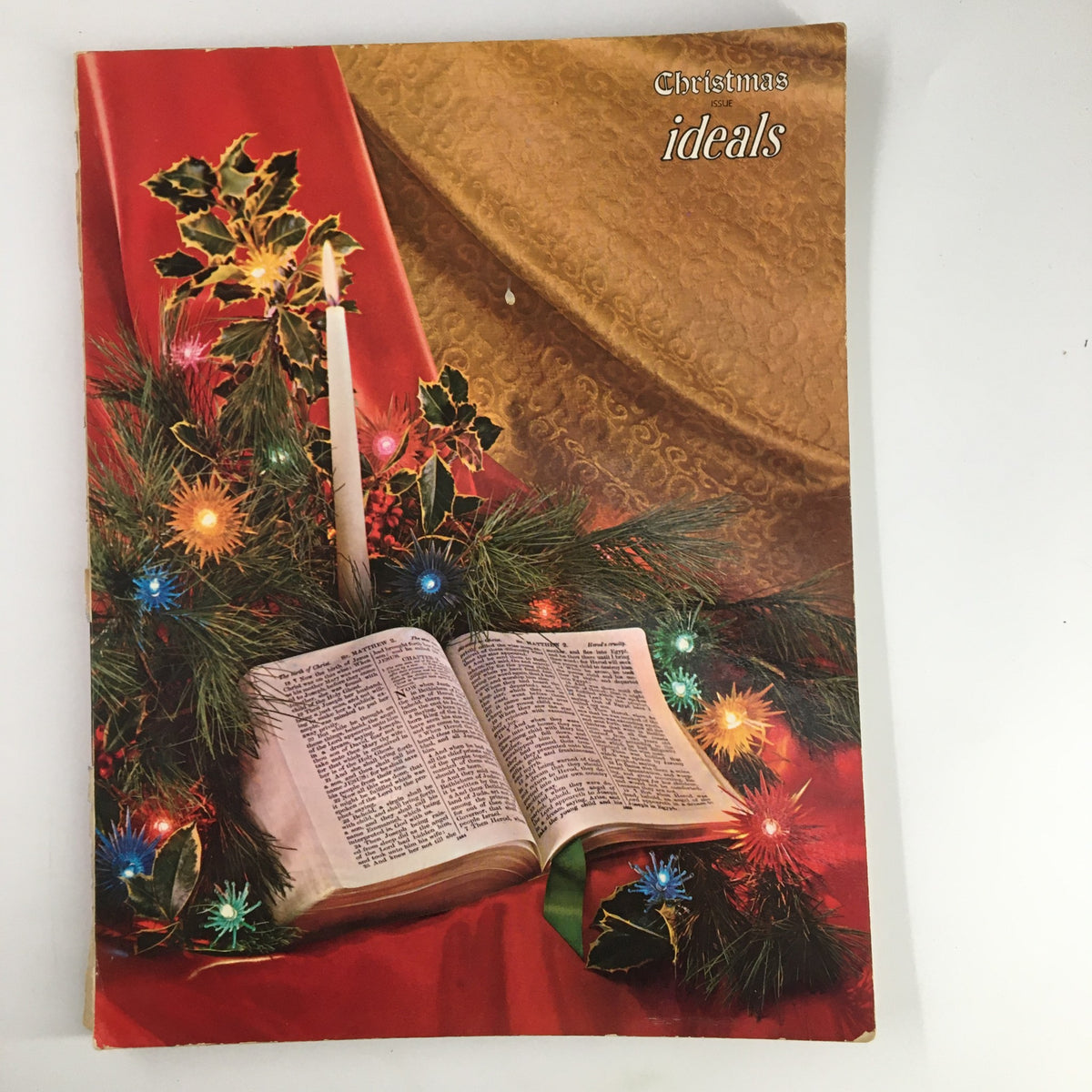 Cover of Ideals Vol. 19 No. 4 October 1962 Christmas Issue featuring festive decorations, pine branches, lights, and a candle next to an open book.