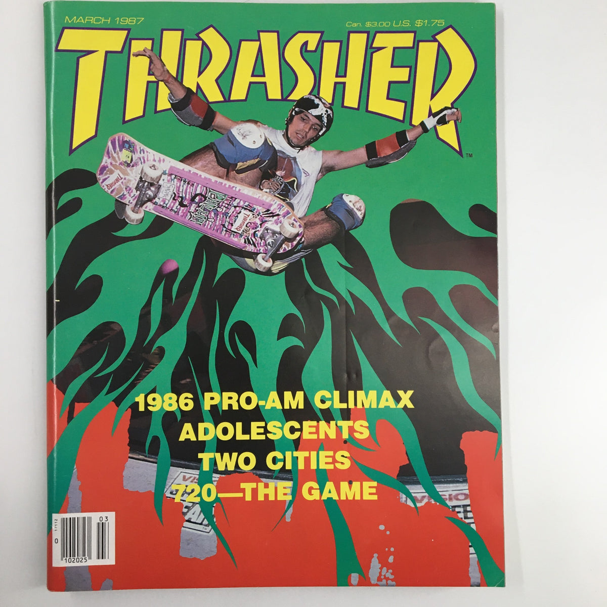 Front cover of VTG Thrasher Magazine March 1987 featuring Jeff Phillips performing an Ollie flight with a vibrant green and black design.