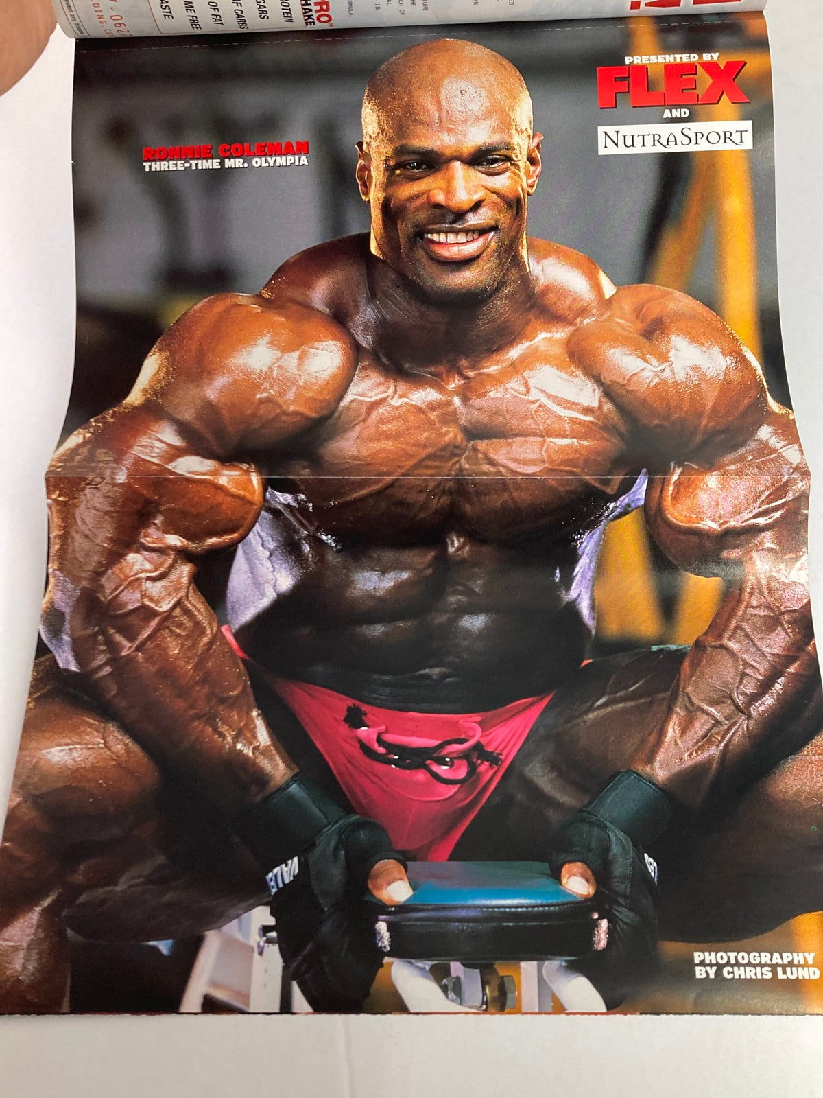 Fold-out poster from Flex Magazine June 2001 Vol 19 #4 featuring Ronnie Coleman, emphasizing his muscular physique and training expertise.