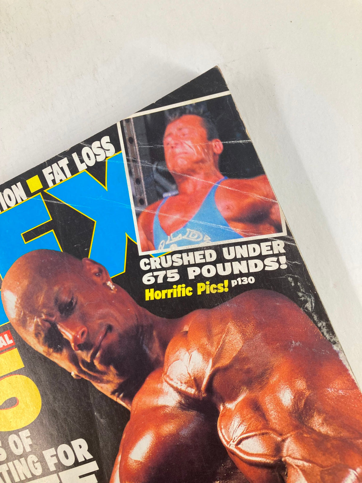 Close-up of Flex Magazine August 2002 showing a feature about a bodybuilder, with text about severe injuries.