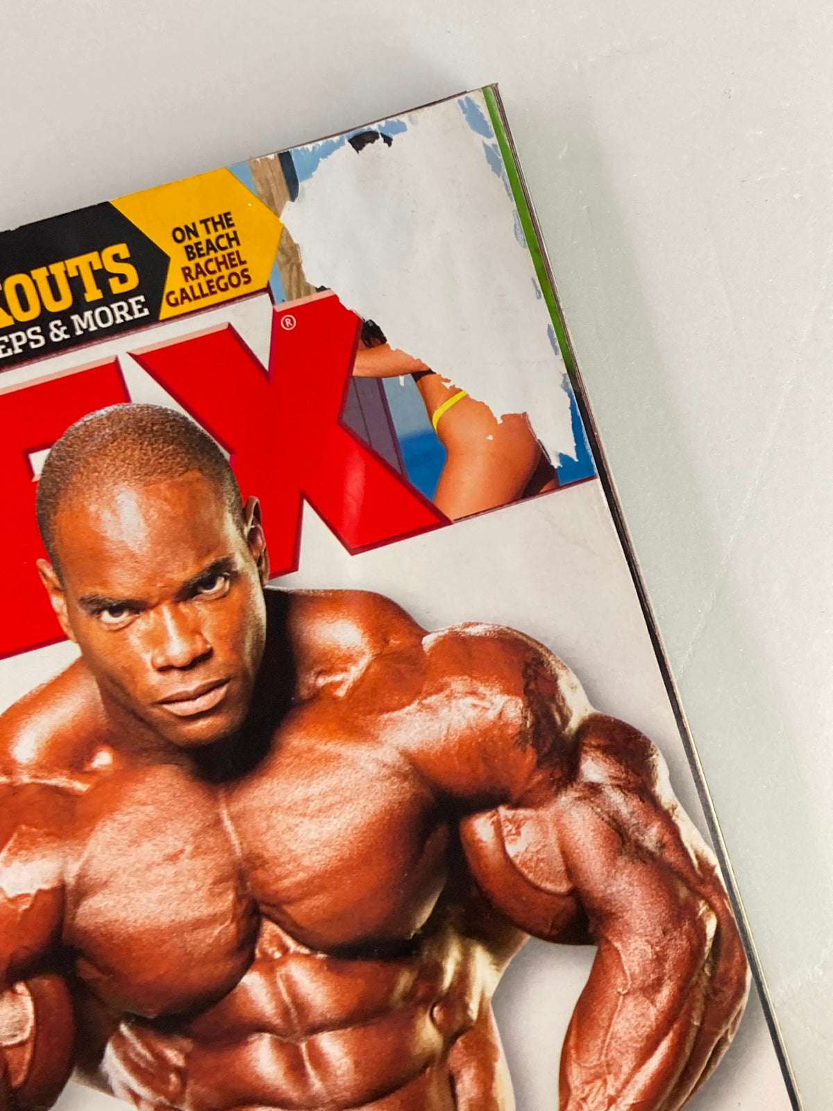 Close-up of the cover of Flex Magazine April 2008 Vol 26 #2, highlighting a minor tear and fitness theme with Johnnie Jackson's image.