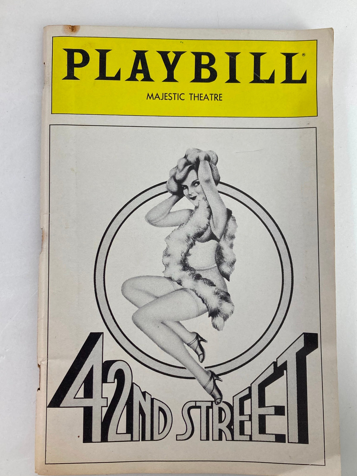 1983 Playbill from the Majestic Theatre featuring the musical '42nd Street', showcasing a vintage design with a dancer illustration.