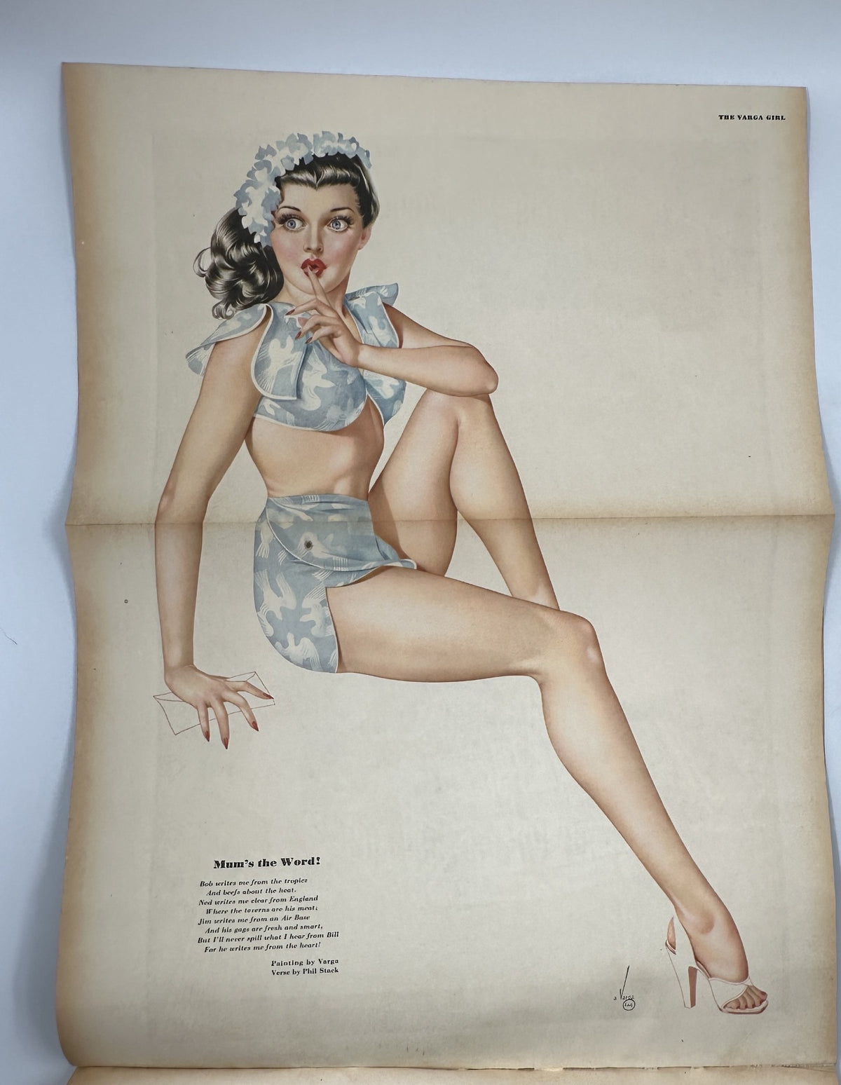 Vintage Varga pinup illustration titled 'Man's the Word' featured in Esquire Magazine October 1945, showcasing glamorous fashion and art.