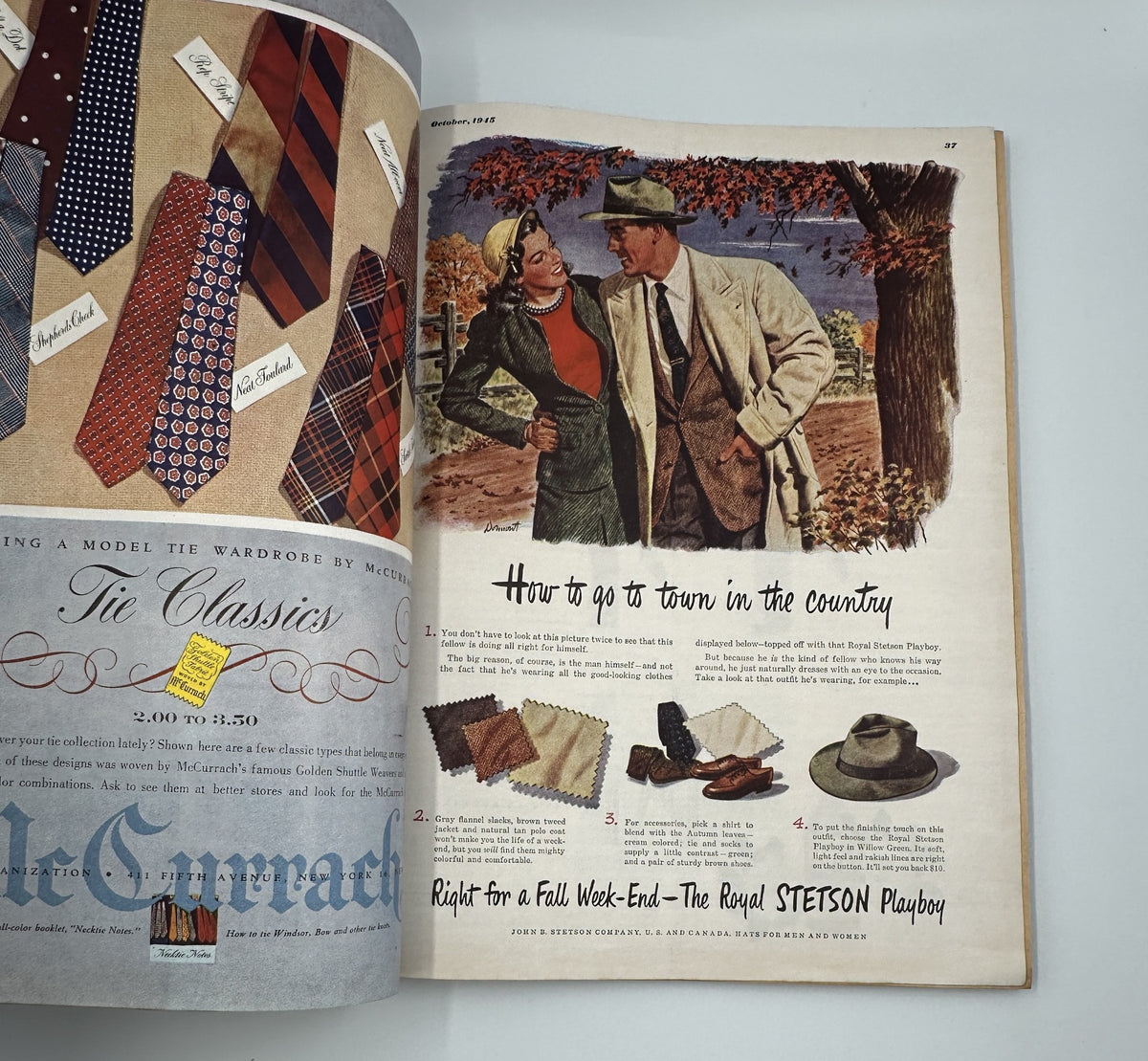 Fashion advertisement in Esquire Magazine October 1945, displaying a couple discussing fall attire, showcasing styles suitable for outdoor events.
