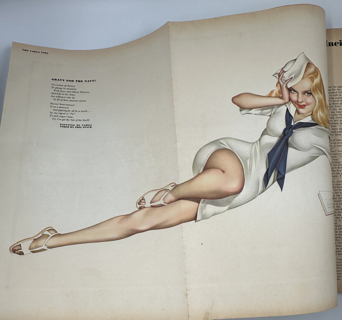 Varga foldout featured in Esquire Magazine April 1945, showcasing a glamorous pinup illustration of a woman in a white dress and sailor hat, highlighting Varga's iconic art style.