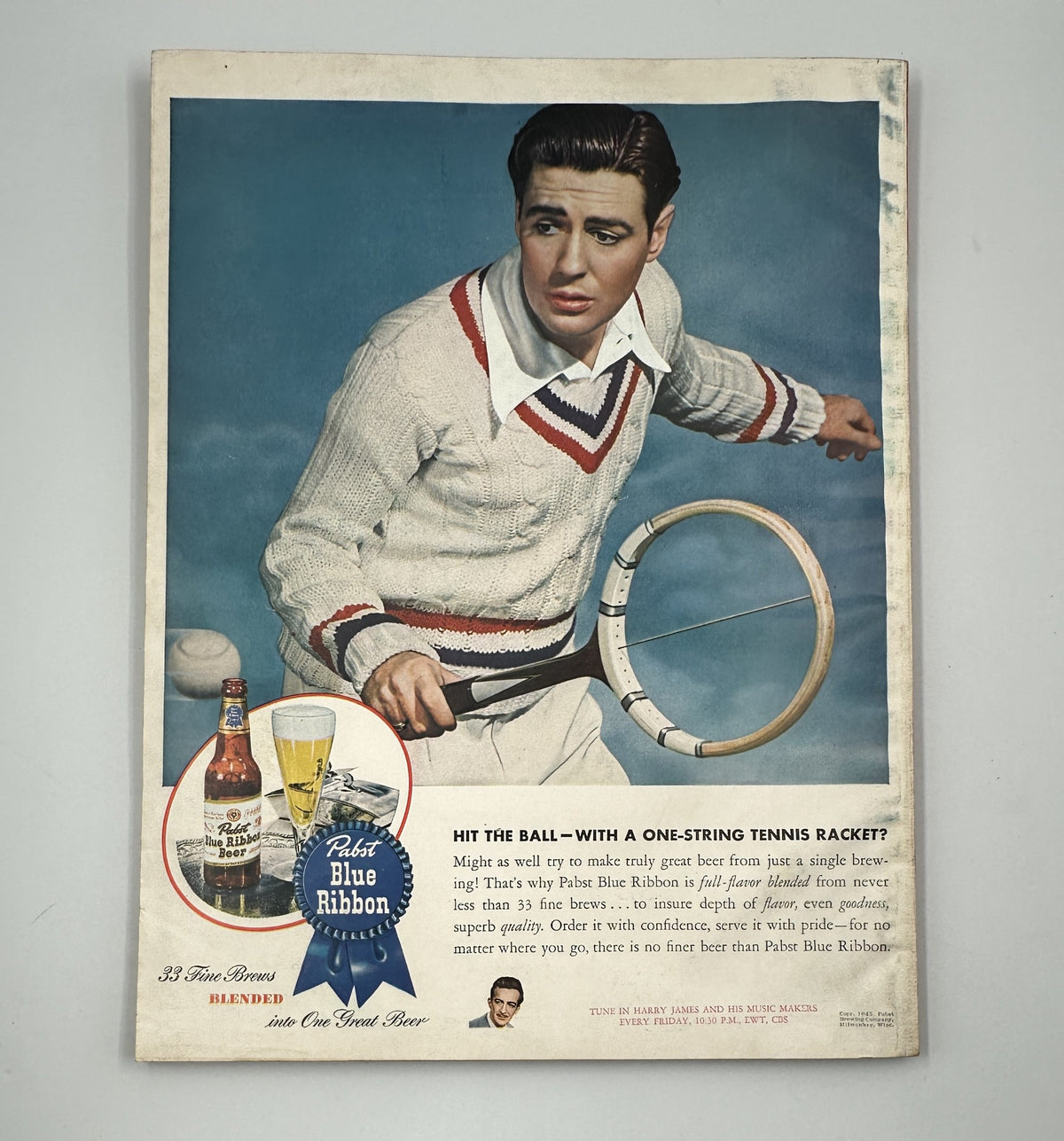 Esquire Magazine July 1945 featuring a promotional image of a young man playing tennis, advertising Pabst Blue Ribbon beer with a sporty aesthetic.