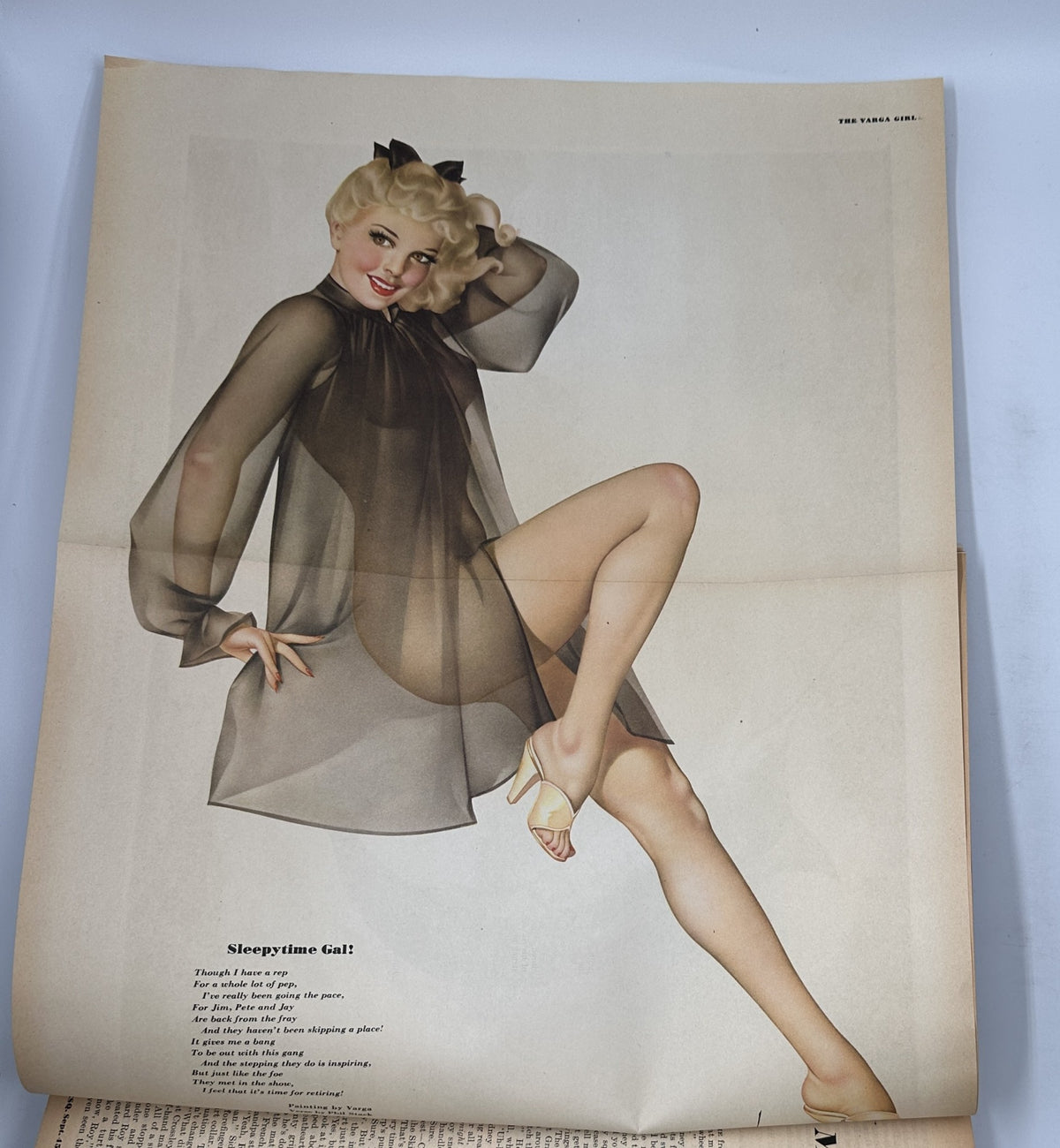 Varga pinup illustration from Esquire Magazine September 1945, titled 'Sleepytime Gal', showcasing a glamorous blonde model in a sheer outfit, emphasizing vintage aesthetics.