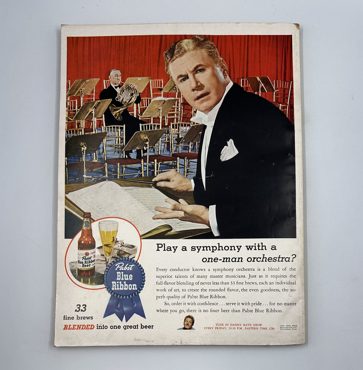 Esquire Magazine January 1946 includes an advertisement featuring a conductor promoting Pabst Blue Ribbon beer, portraying the connection between music and fine brews, underlining the cultural ambiance of the time.