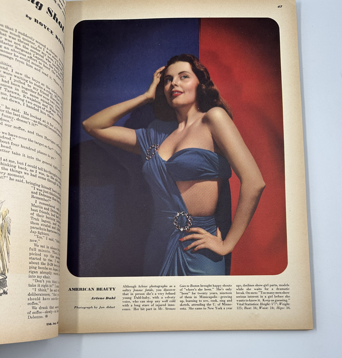 'American Beauty' feature from Esquire Magazine August 1946, showcasing a glamorous model in a blue dress against a vibrant backdrop, highlighting fashion photography from Arlene Dahl.