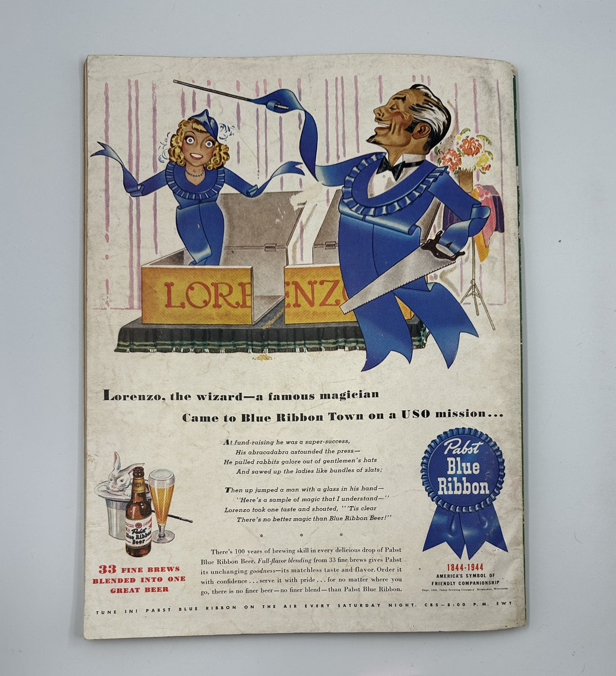 Esquire Magazine September 1944 back cover illustration showcasing a magician and a woman performer, promoting Pabst Blue Ribbon beer with a humorous advertisement.