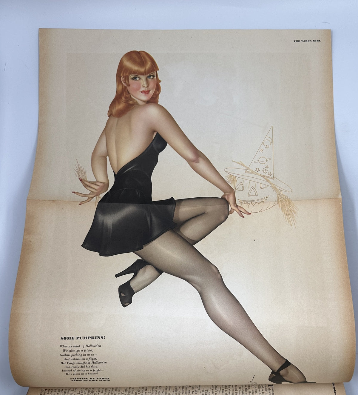 Pinup art featured in Esquire Magazine October 1944 depicting a woman in a black dress, demonstrating the iconic style and allure of vintage pinup illustrations.