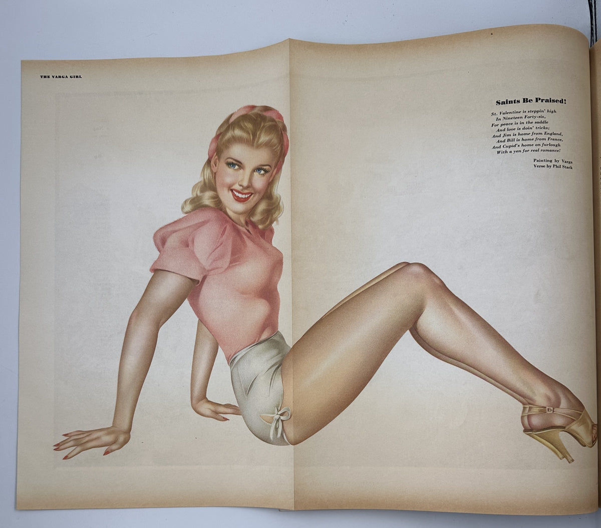 Esquire Magazine February 1946 Varga Foldout pinup illustration titled 'Saints Be Praised' featuring a smiling woman in a pink top and shorts, showcasing the iconic Varga style artwork.