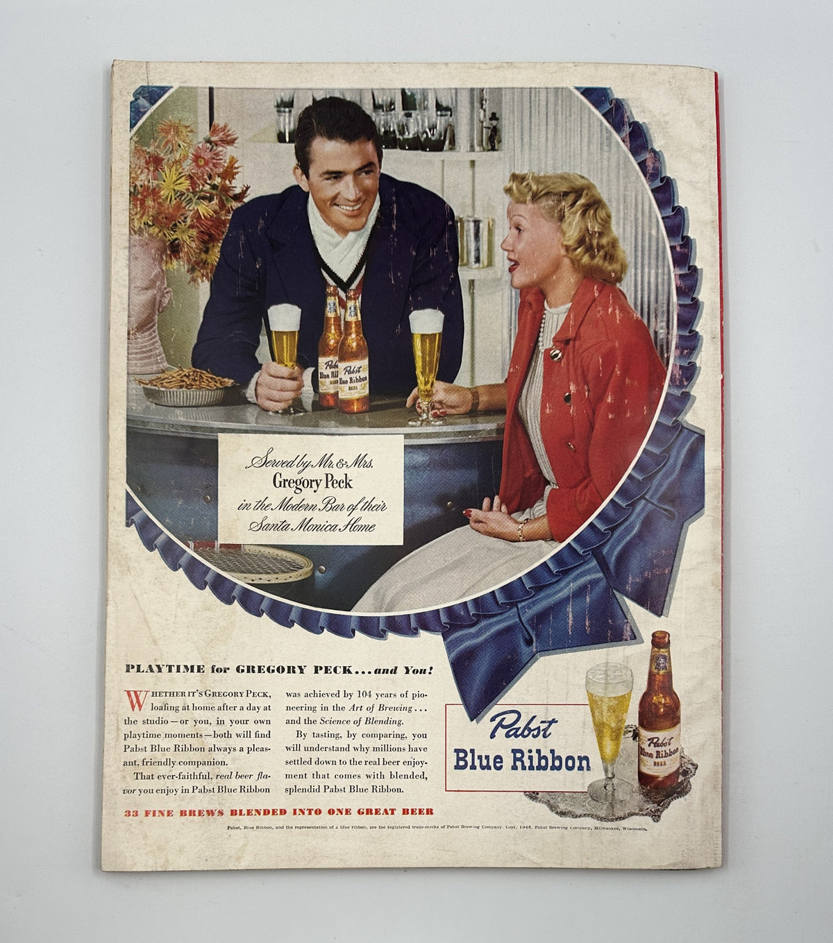 Vintage advertisement from Esquire Magazine July 1948 featuring Gregory Peck promoting Pabst Blue Ribbon beer, highlighting classic Americana.