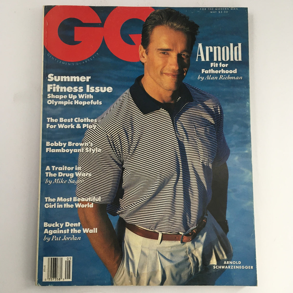 GQ Magazine May 1990 featuring Arnold Schwarzenegger on the cover, showcasing the theme "Fit for Fatherhood". This vintage magazine highlights Schwarzenegger's journey as a father and a Hollywood icon.