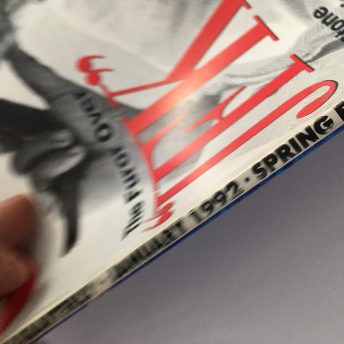 A close-up view of the spine and title of GQ Magazine January 1992, emphasizing the edition's focus on John F. Kennedy and the controversies surrounding him.