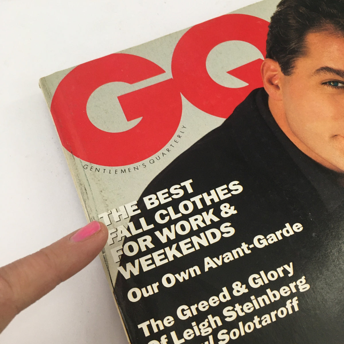 Detail of the top corner of GQ Magazine November 1991 displaying the title and featured stories such as 'The Greed & Glory of Leigh Steinberg', featuring Ray Liotta and Jerry Seinfeld.