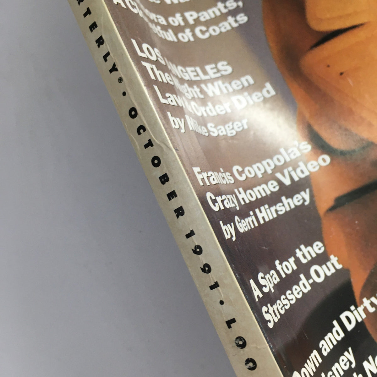 Close-up of the spine of GQ Magazine October 1991, highlighting the articles including 'Francis Coppola's Crazy Home Video' and 'Los Angeles: The Night When Law & Order Died'.