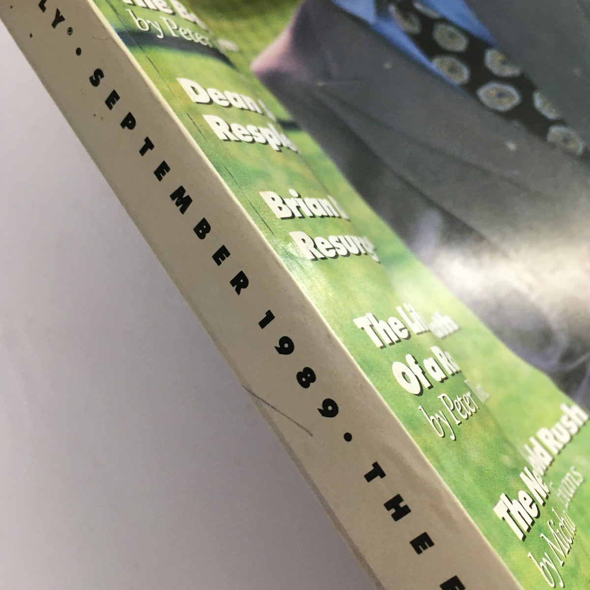 Close-up view of the edge of GQ Magazine September 1989 featuring Andre Agassi, Dean Stockwell, and Brian DePalma. The image shows the magazine spine and the date, September 1989, along with text highlights of featured articles.