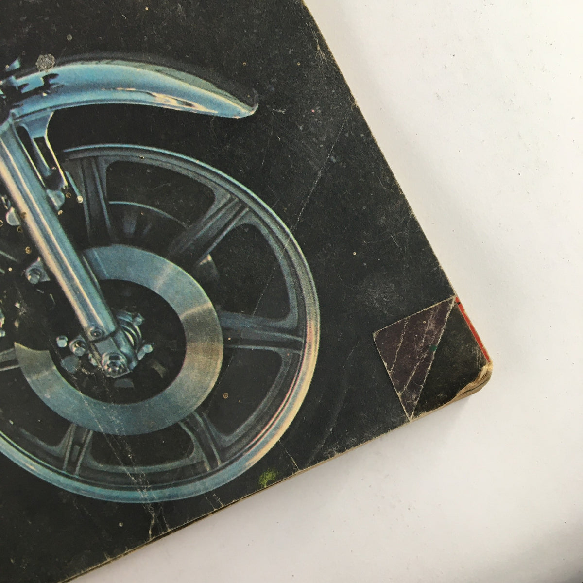 Close-up view of the wheel assembly from the Cycle Magazine June 1976 cover featuring Yamaha XS750D Triple and Penton 250 MC 5 Moiseev Replica, showcasing vintage motorcycle design.